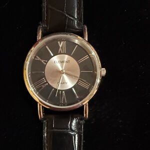 Element quartz watch with a black alligator-embossed genuine leather strap.